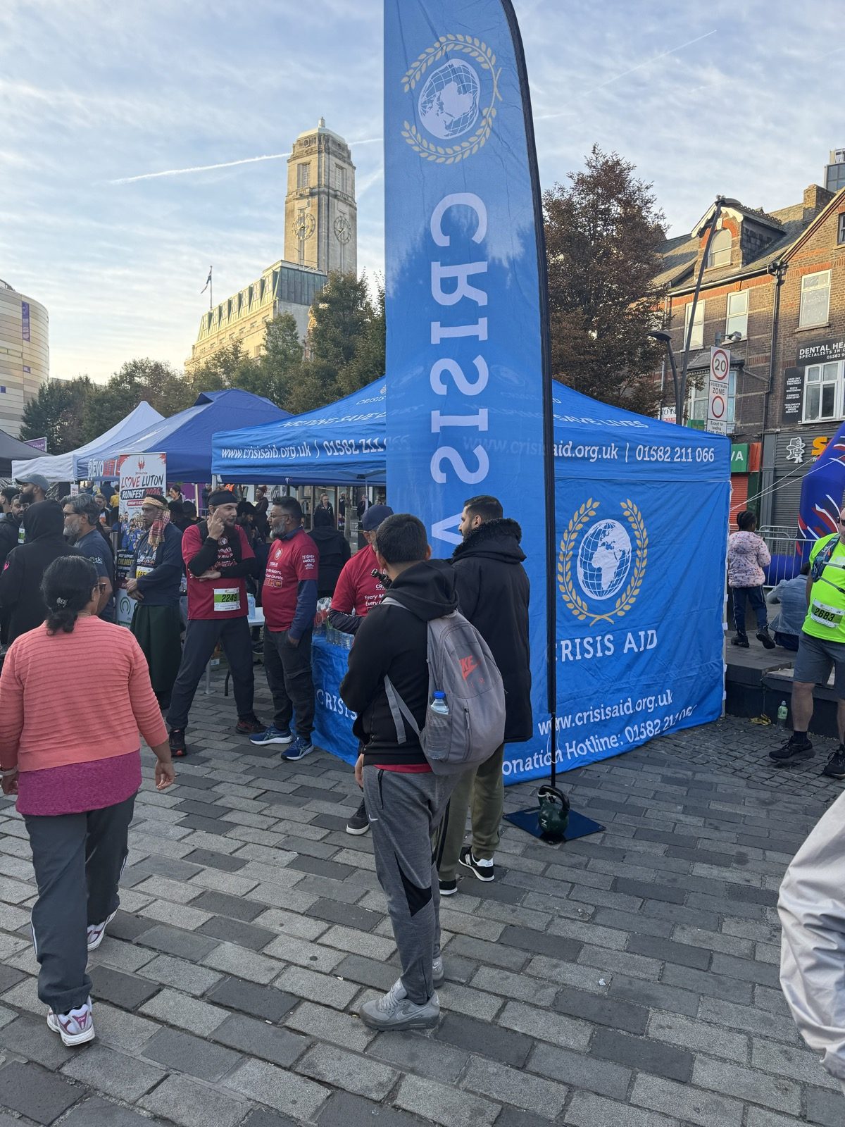 The Crisis Aid gazebo and feather flag at Love Luton RunFest 2026